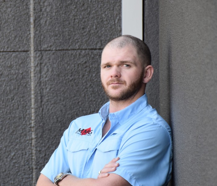 Image of Project Manager posing for a company photograph